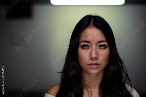 Fotografie Pretty serene dark haired young woman