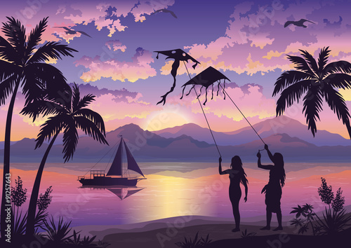 People with Kites on tropical beach