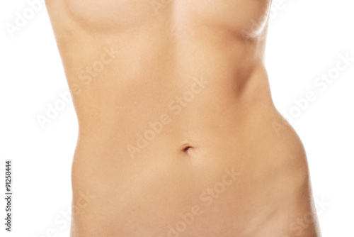 Slim naked woman's belly