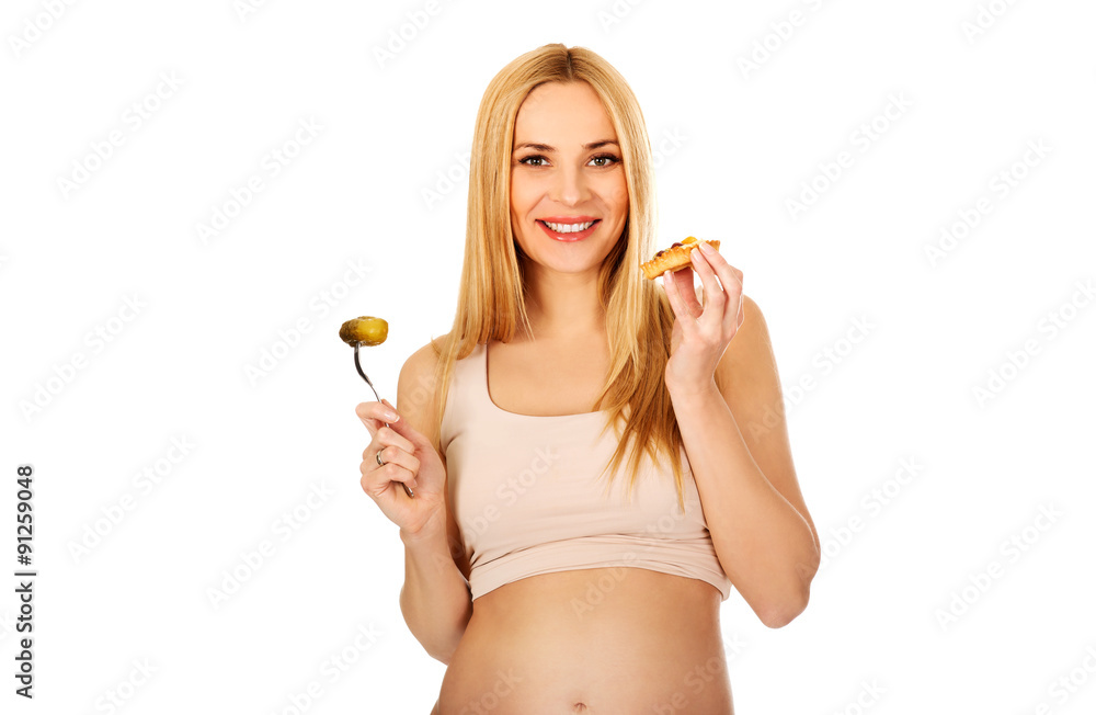Happy pregnant woman with cake and pickles Happy pregnant woman with cake and pickles