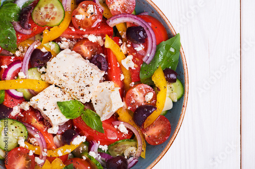Greek salad with fresh vegetables, feta cheese, black olives