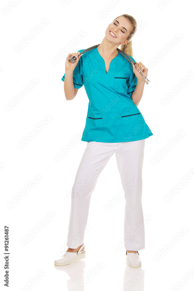 Happy female doctor or nurse with stethoscope Happy female doctor or nurse with stethoscope