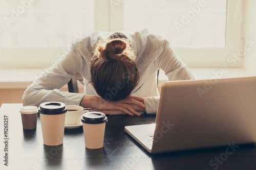 Stressed businesswoman in the office. Tired woman working at home. Business, stress, people, depression, pressure, career, crisis, problems concept photo