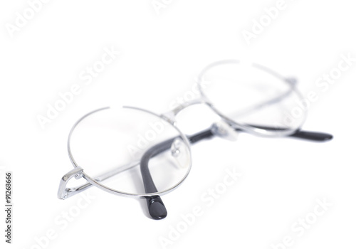 Folded round eyeglasses isolated on white background