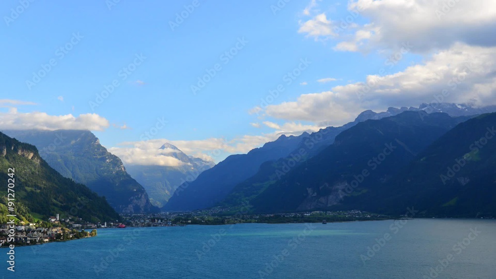 Aerial view of the mountain landscape and lake. Below a small town in central Switzerland Aerial view of the mountain landscape and lake. Below a small town in central Switzerland