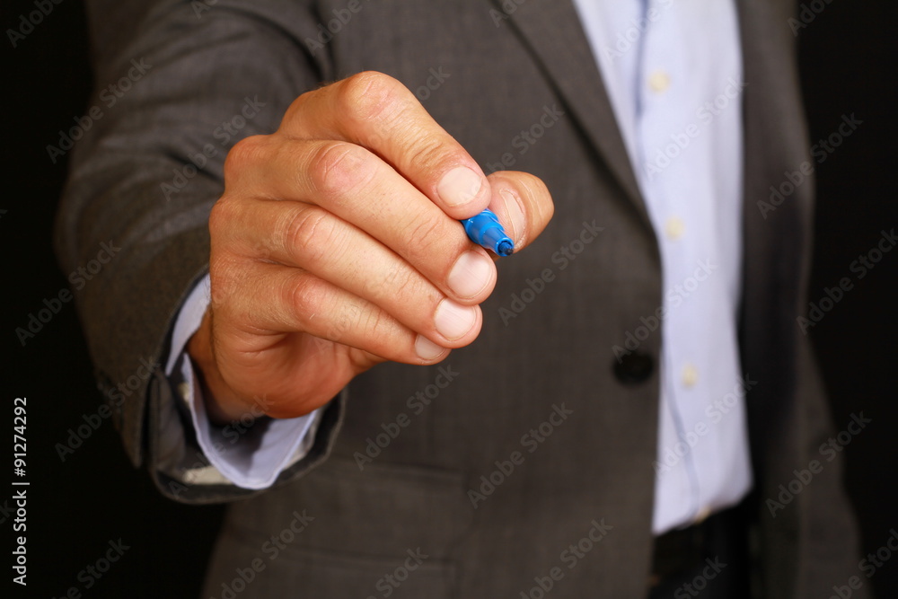 Businessman drawing with a blue marker, pencil. Business concept Businessman drawing with a blue marker, pencil. Business concept