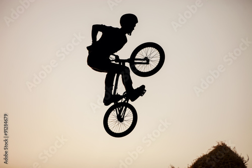 Extreme rider making a bike jump