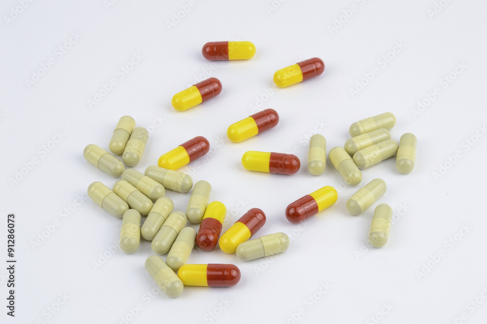 Yellow and red capsules isolated