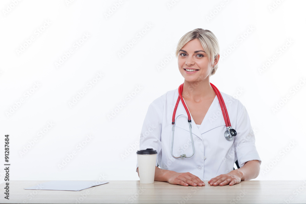 Beautiful young female physician is working with joy Beautiful young female physician is working with joy