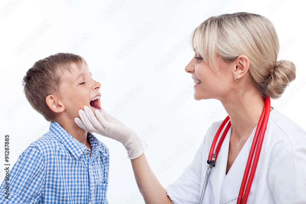 Cheerful young female doctor is seeing the little child Cheerful young female doctor is seeing the little child