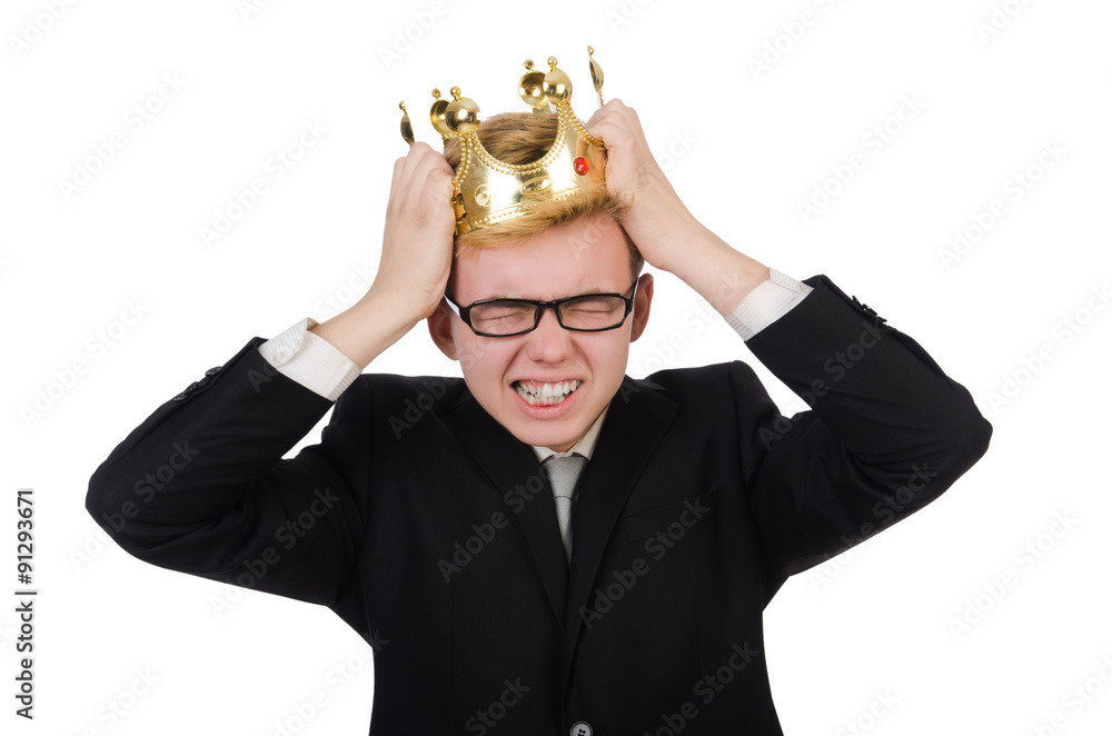 Fototapeta premium Young businessman with crown isolated on white