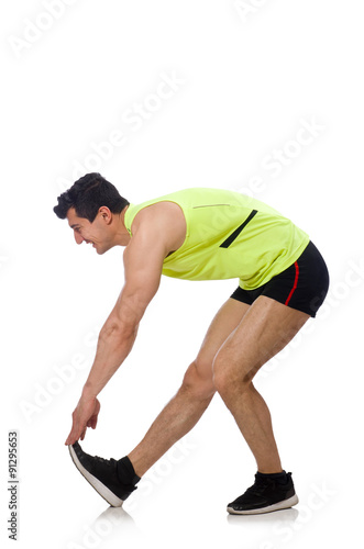 Young man exercising on white