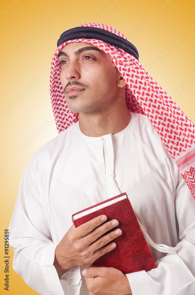 Fototapeta premium Arab man praying on white
