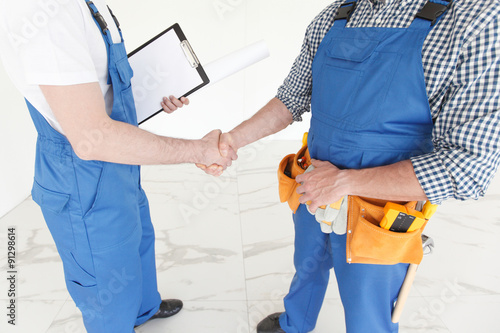 workmen handshake