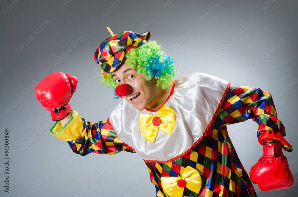 Clown with boxing gloves isolated on white Clown with boxing gloves isolated on white