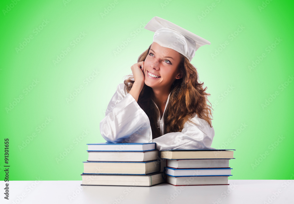Happy graduate with lots of books on white Happy graduate with lots of books on white