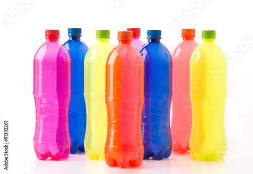 Bottles of soft drinks on white background