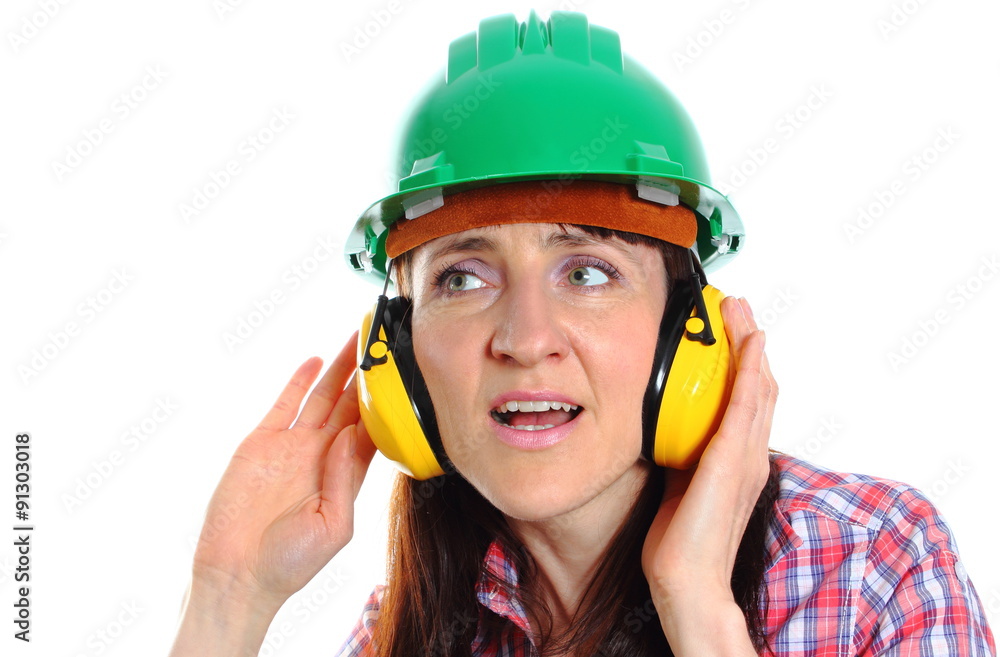 Woman wearing protective helmet and headphones Woman wearing protective helmet and headphones