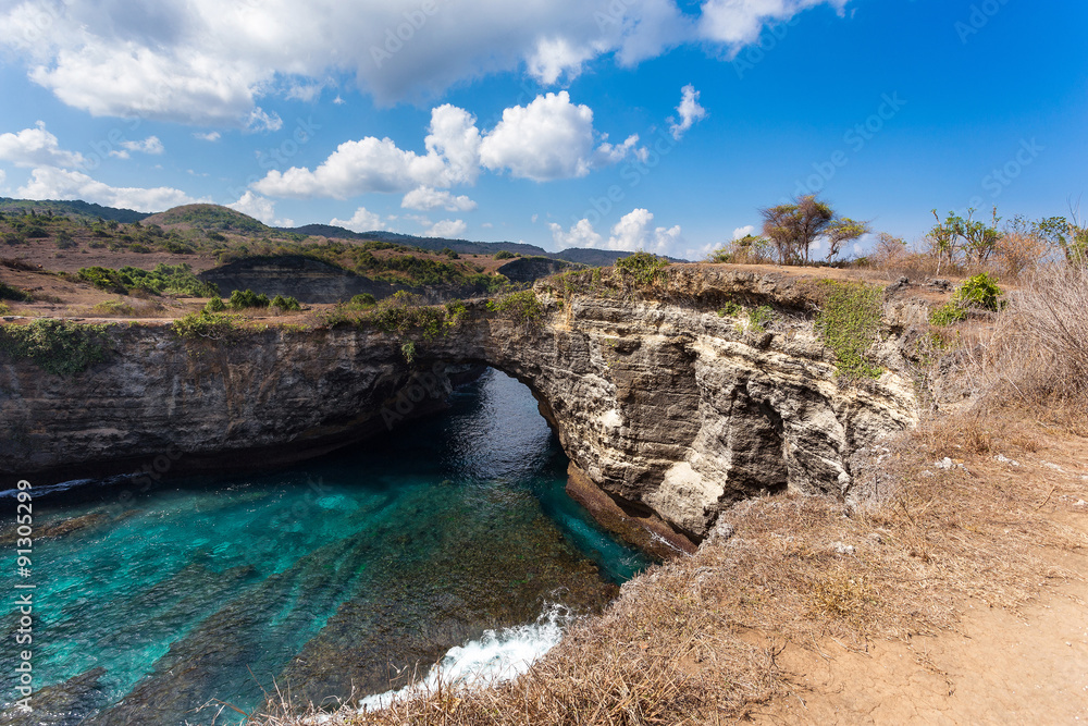 Fototapeta premium tunnel crater coastline at Nusa Penida island