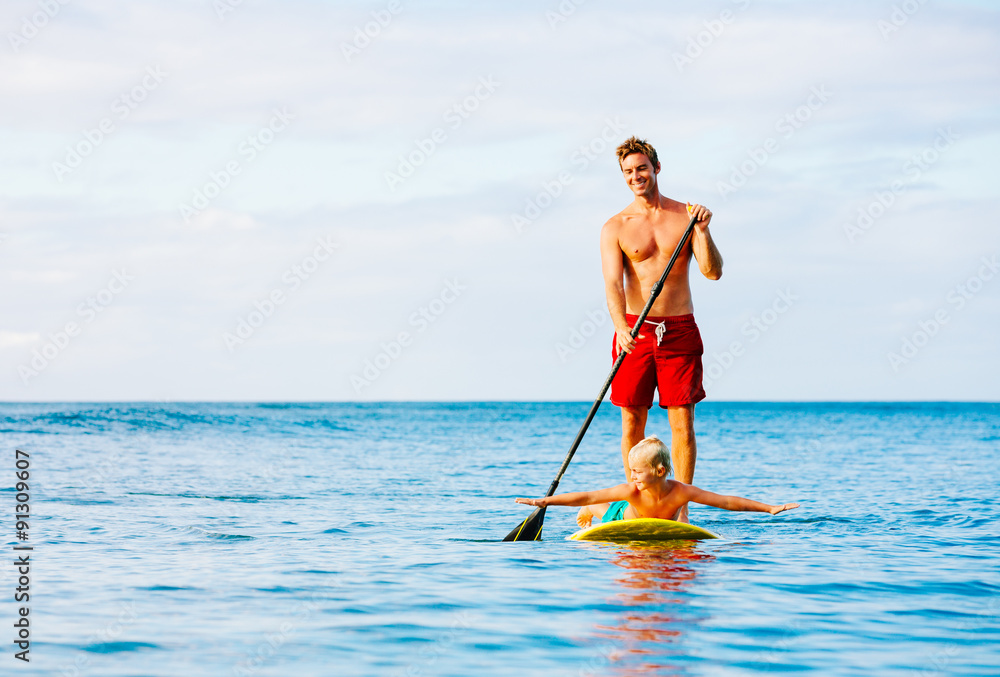 Naklejka premium Father and Son Stand Up Paddling