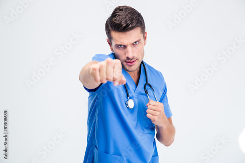 Portrait of a male doctor fighting