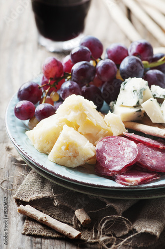Antipasto with cheese, sausage and grape