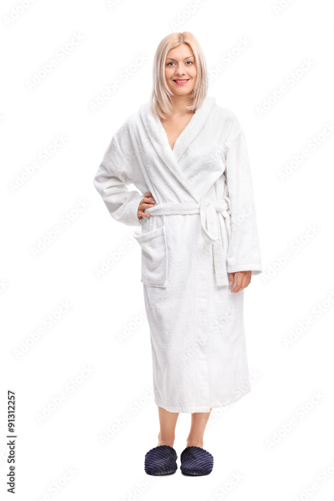 Full length portrait of a young blond woman in a white bathrobe Full length portrait of a young blond woman in a white bathrobe