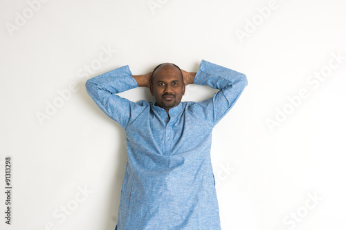 Traditional Indian man relaxed photo