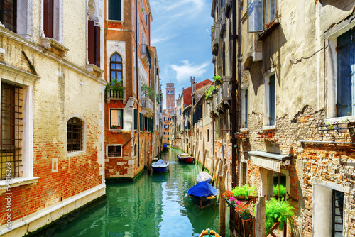 The Rio di San Cassiano Canal with boats in Venice, Italy