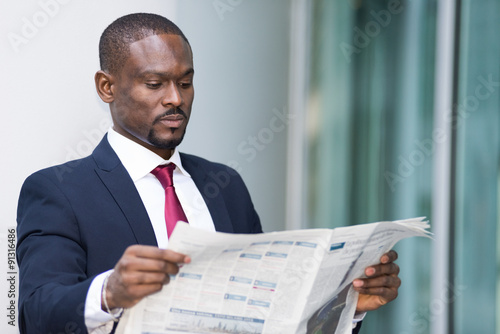 Businessman reading a newspaper
