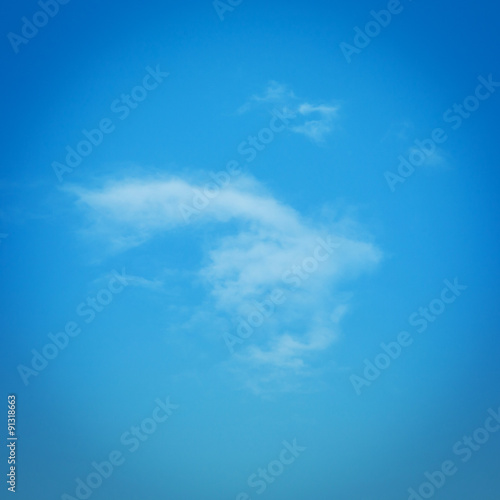 blue sky weather background with single white clouds
