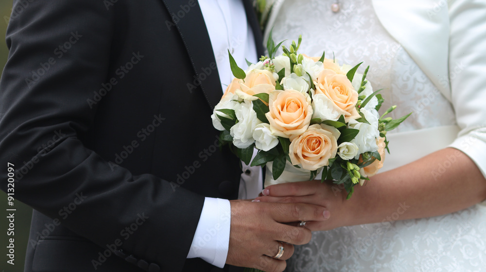 Bride with groom holding wedding bouquet Bride with groom holding wedding bouquet