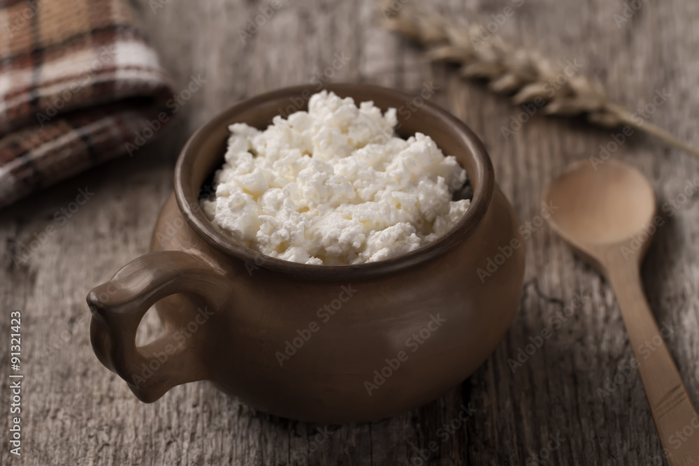 fresh tasty curd in pot on wooden background. Homemade, cottage cheese fresh tasty curd in pot on wooden background. Homemade, cottage cheese