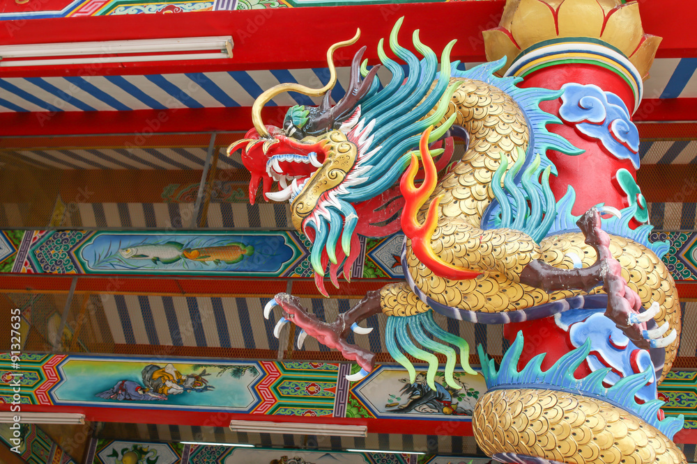 Golden dragon wrapped around the pole