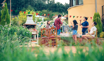 Group of friends enjoying in a summer barbecue