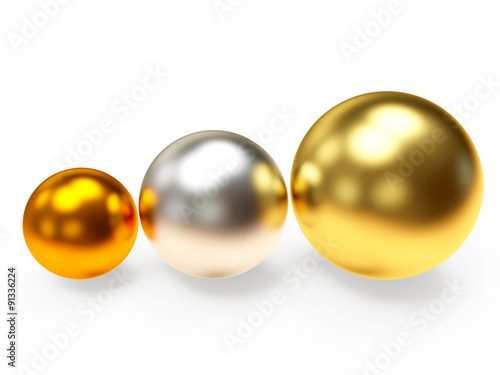 Three shining golden,silver and bronze balls isolated on white background