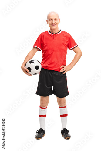 Mature man in a red jersey holding a football © Ljupco Smokovski