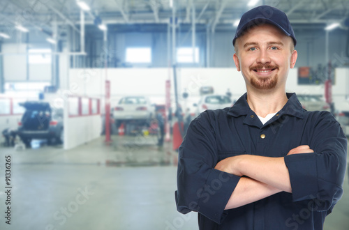 Wallpaper Mural Smiling car mechanic in auto repair service. Torontodigital.ca