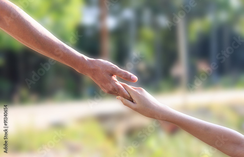 helping hands - father hoding son hand © banprik