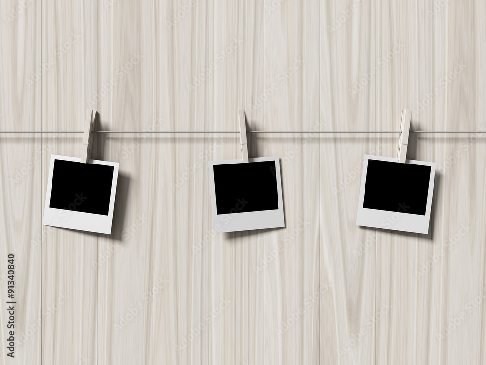 Fototapeta premium empty polaroid photos frames on wood background