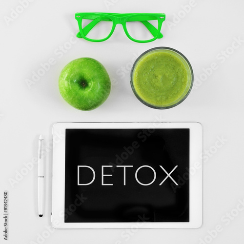 apple, smoothie, eyeglasses and word detox in a tablet computer