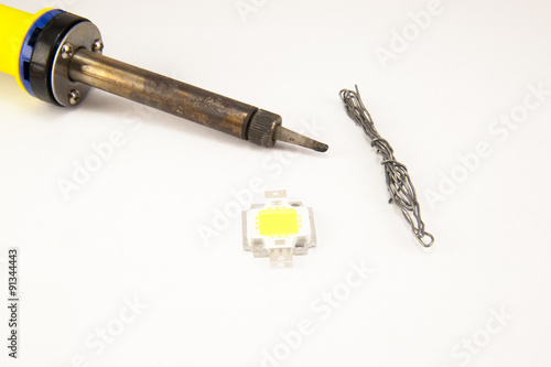 Soldering iron over white background