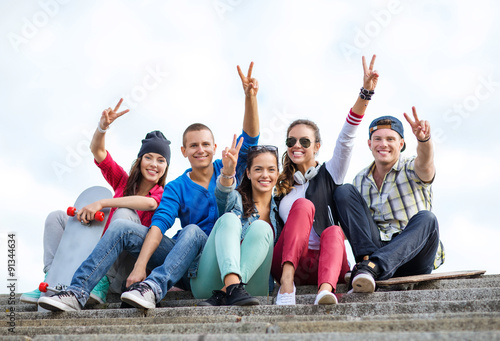 group of teenagers showing finger five