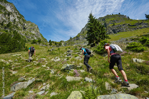 Vászonkép Group of hikers on a mountain trail