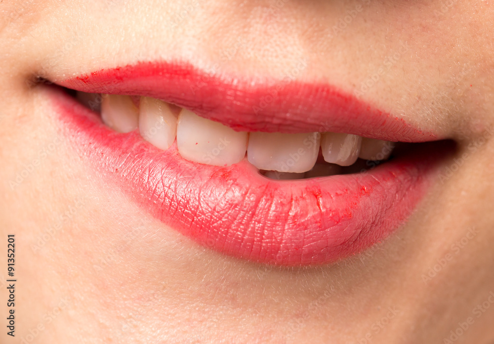 Close-up shot of woman lips with glossy red lipstick Close-up shot of woman lips with glossy red lipstick