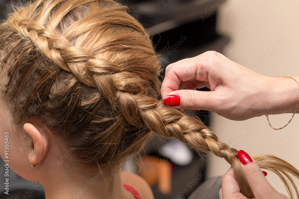 Fototapeta premium braided pigtails in the beauty salon