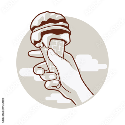 An ice cream cone on hold by hand