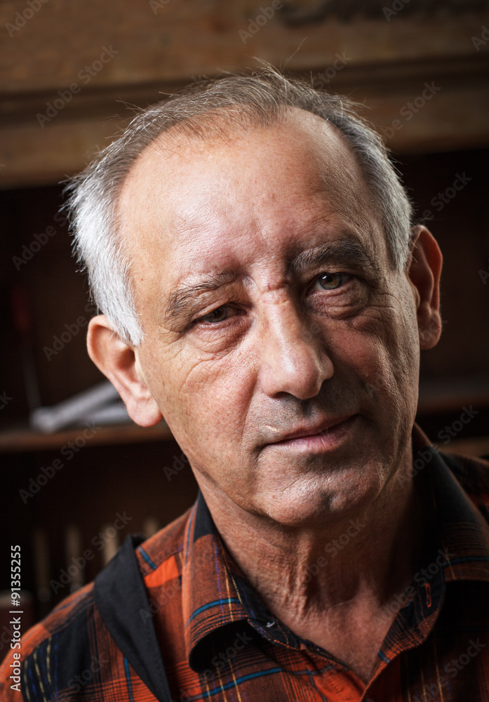 Close-up of a senior carpenter, Front view. Close-up of a senior carpenter, Front view.