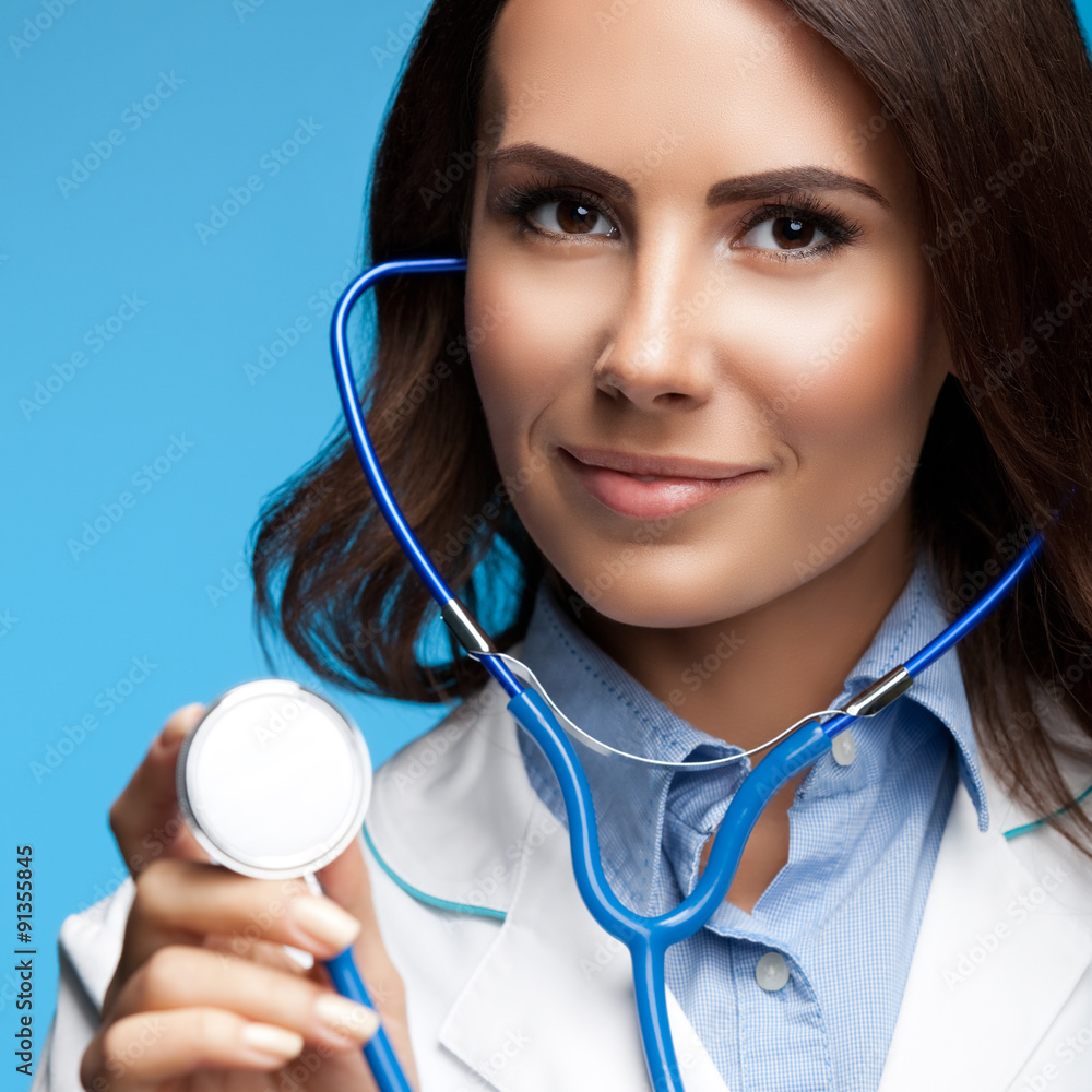 doctor with stethoscope in hand, on blue doctor with stethoscope in hand, on blue