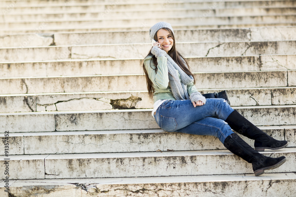 Young woman sitting on the stairs outdoor Young woman sitting on the stairs outdoor
